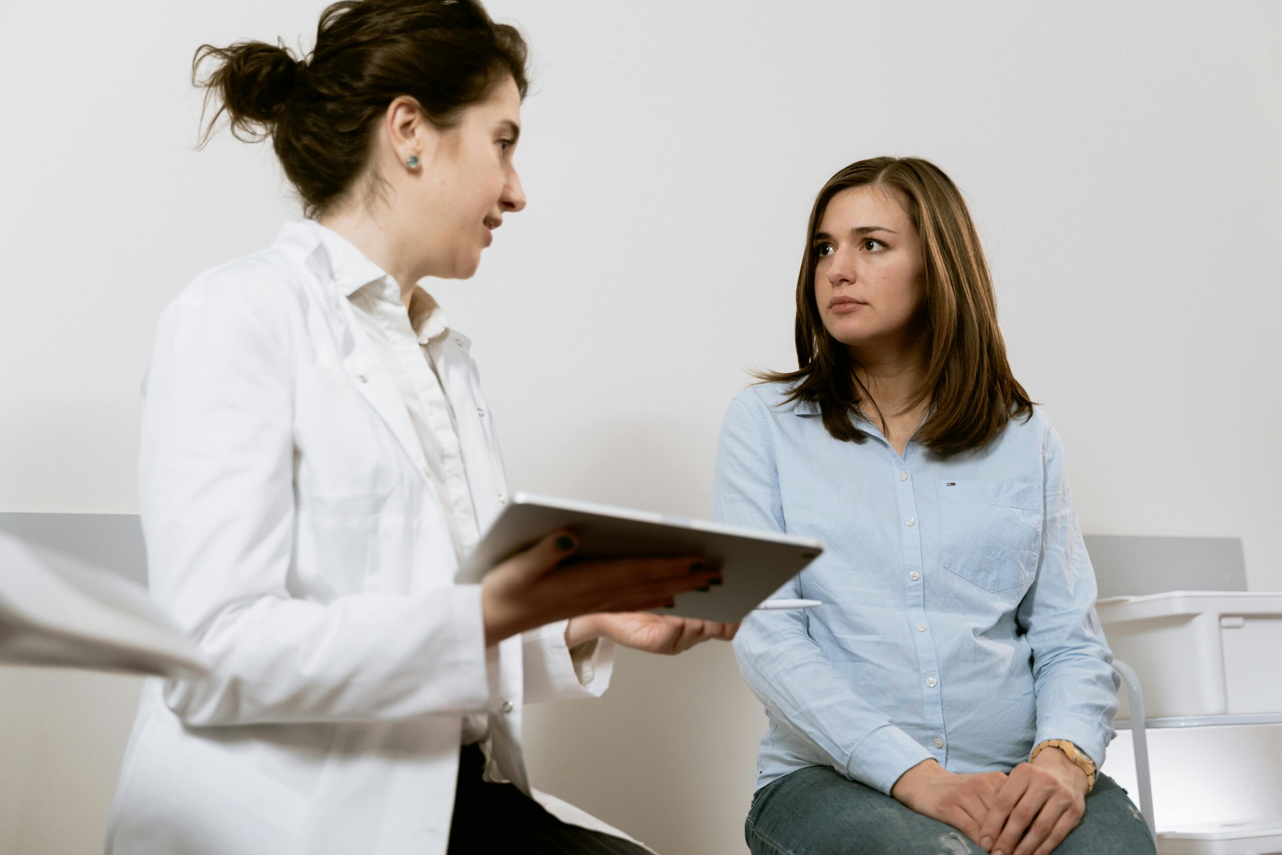 Hormone specialist reviewing a patient’s health history and test results.